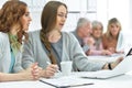 Portrait of group of active business people working