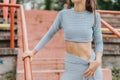 A group of active individuals engage in cardio exercises and sports training in an urban park. Fit females inspire a Royalty Free Stock Photo