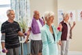 Group of active seniors exercising together at gym Royalty Free Stock Photo