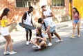 Group of active teenagers making recreational activity in an urban area. Royalty Free Stock Photo