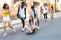 Group of active teenagers making recreational activity in an urban area. Royalty Free Stock Photo