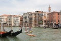 Group of active tourists stand up paddling on sup boards at Grand Canal, Venice, Italy.