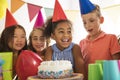 Group of adorable kids having fun at birthday party