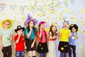 Group of adorable kids having fun at birthday party Royalty Free Stock Photo