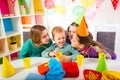 Group of adorable kids having fun at birthday party, selective focus Royalty Free Stock Photo