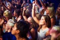 A group of adoring fans singing along to their favorite song. This concert was created for the sole purpose of this Royalty Free Stock Photo