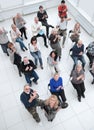 Group of adult listeners applauding in the conference room .