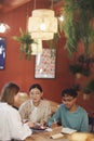 Group of Adult Students in Cafe