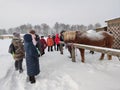 A group of adults on an excursion to the Falconry Center in Mytishchi district.