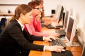 Group of adults learning computer skills. Intergenerational tran Royalty Free Stock Photo