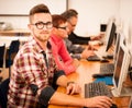 Group of adults learning computer skills. Intergenerational tran Royalty Free Stock Photo