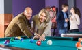 Group of adults playing pool Royalty Free Stock Photo