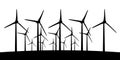 Group of aeolian windmills in perspective silhouette