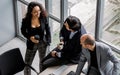 Group aerial or top view three formal businesspeople meeting, sitting and discussing together with relaxation in indoor modern Royalty Free Stock Photo