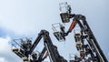 Group of aerial work platforms for construction and material handling. Close-up on the metal lift