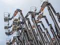 Group of aerial work platforms for construction and material handling. Close-up on the metal lift