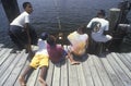 Group of African-American children fishing off dock, Ft. Myers, FL Royalty Free Stock Photo