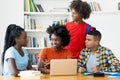 Group of african american and latin students coding app at computer Royalty Free Stock Photo