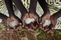 Group of African Black Children Holding Rice Malnutrition Starvation Hunger. Starving Hunger Symbol. Black African girls holding Royalty Free Stock Photo