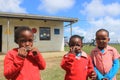 Group of African children playing harmonica outdoors in a playground, Swaziland, southern Africa Royalty Free Stock Photo