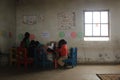 Group of african children studying by a desk in rural Swaziland