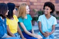 Group of african and latin american girls talking about problems Royalty Free Stock Photo