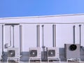 Group of air conditioner compressors with ventilation equipment and pipe lines system outside of building with blue sky