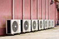 Group of air conditioner outdoor units outside of building