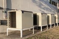Group of air conditioner outdoor units outside of building
