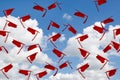 group of airborne red gradation caps in sky