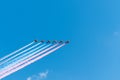 Group of airplanes makes Russian flag in the sky with colorful smoke, red, blue and white.