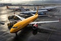 A group of airplanes are parked on the airport tarmac Royalty Free Stock Photo