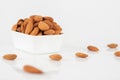 Group of almonds on white background