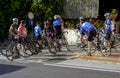 group of amateur cyclists refreshes in front of a public fountain