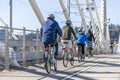 Group of amateur cyclists rides on bikes across the Tilikum Crossing Bridge enjoying an informative sightseeing trip