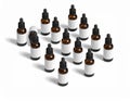 Group of Amber Essential Oil Bottles with Droppers on White Background Isometric View Royalty Free Stock Photo