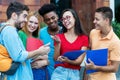 Group of american and latin and african students talking about homework Royalty Free Stock Photo