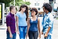 Group of american and latin young adults talking and hanging out Royalty Free Stock Photo