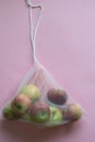 Group of apples in a handmade cotton bag, no plastic and eco-friendly trendy concept. Reusable things