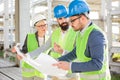 Group of architects or business partners having meeting on a construction site Royalty Free Stock Photo