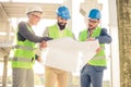 Group of architects or business partners meeting on a construction site Royalty Free Stock Photo
