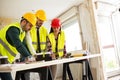Group of architects consult about the project on construction si Royalty Free Stock Photo