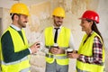 Group of architects talking on coffee break at construction site Royalty Free Stock Photo