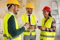 Group of architects talking on coffee break at construction site Royalty Free Stock Photo