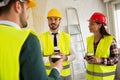 Group of architects talking on coffee break at construction site Royalty Free Stock Photo