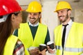 Group of architects talking on coffee break at construction site Royalty Free Stock Photo