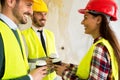 Group of architects talking on coffee break at construction site Royalty Free Stock Photo