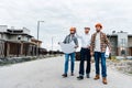 group of architects walking by constructing street