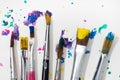 Group of Art Paint brushes and colorful splatter Royalty Free Stock Photo