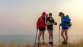 Group asia friends traveler with backpack adventure holding map to find directions and walking relax